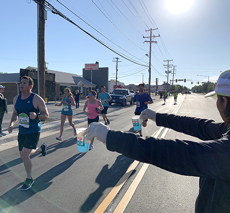 FSB employees running a water stop during the 2019 Oklahoma City Memorial Marathon